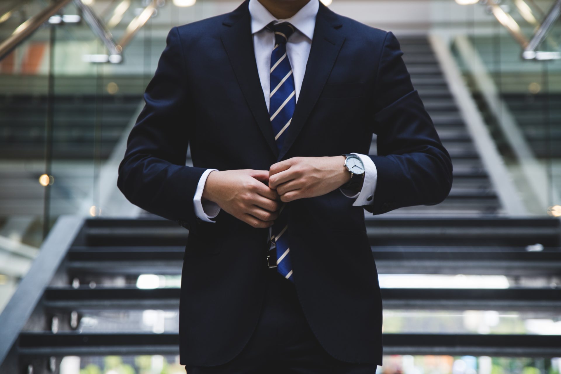 man fixing suit in the office